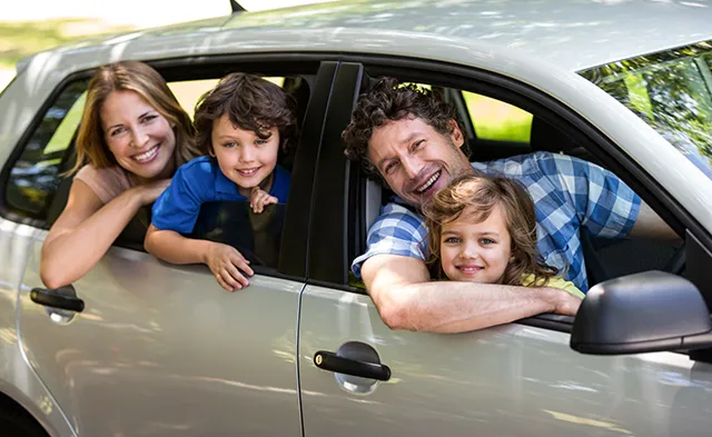 Family in luxury car