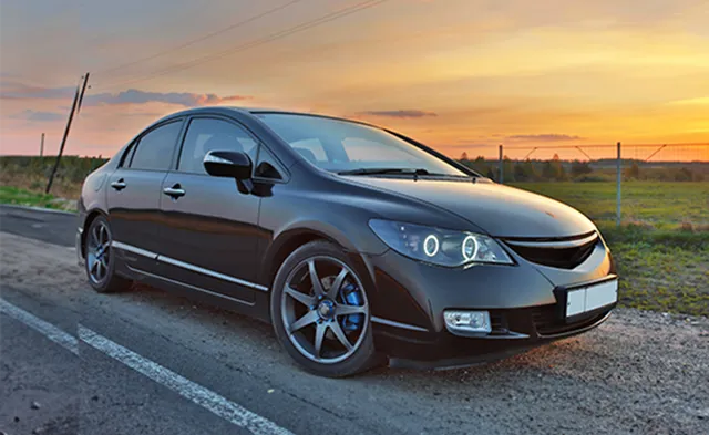 Luxury car at sunset