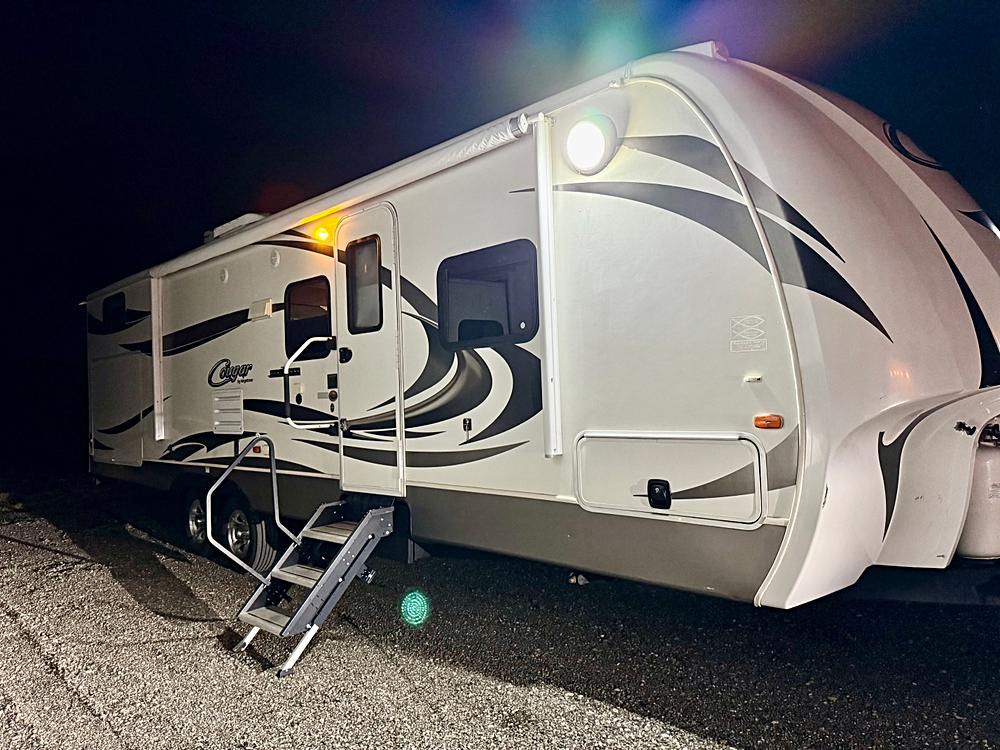 Experience the Comfort of Home on the Road with the 2013 34ft Cougar Light Bunk Model Travel Trailer