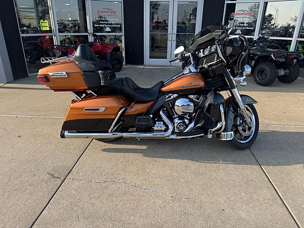 Gliding in Color: The 2014 Harley-Davidson Electra Glide Ultra Limited in Orange and Black
