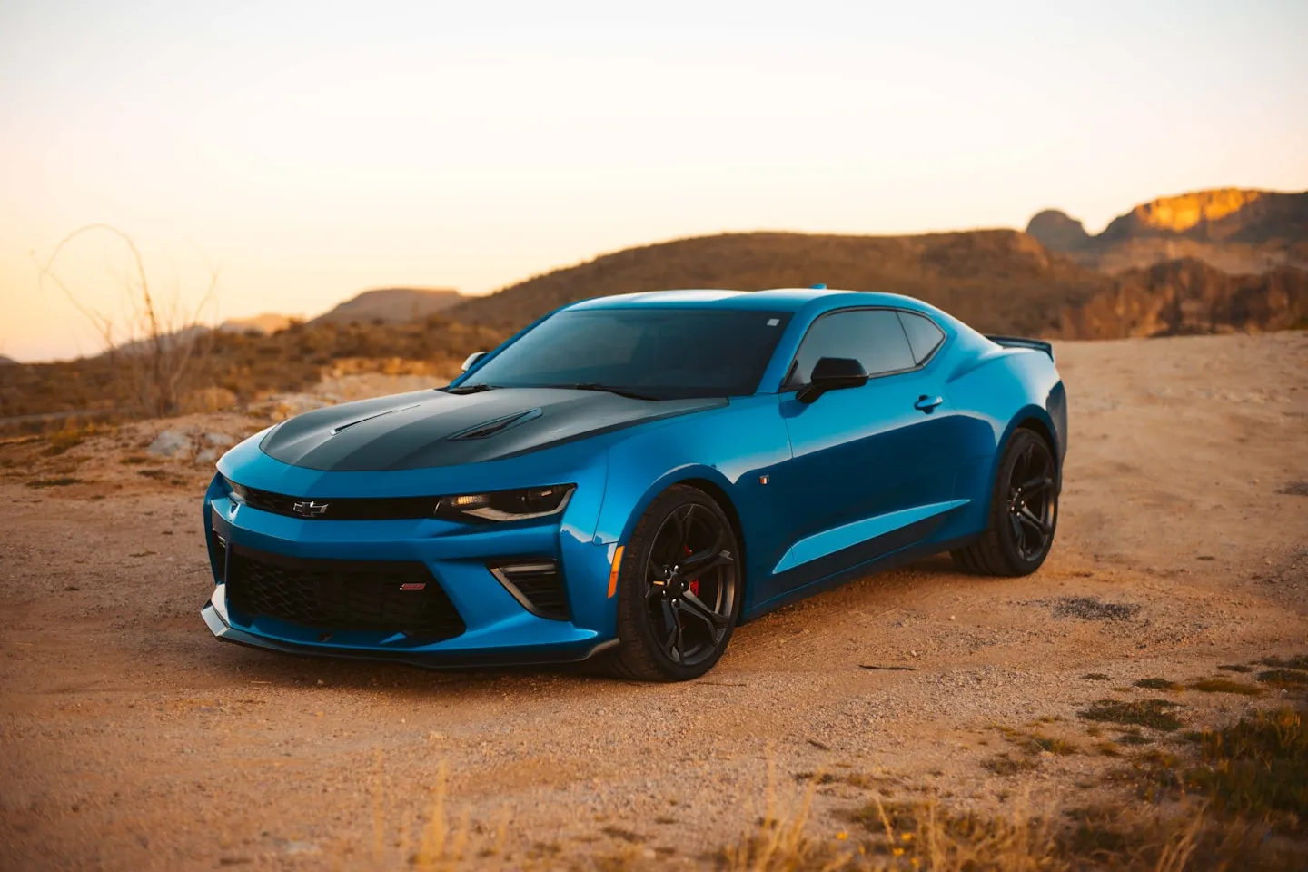 Blue Chevrolet Camaro in desert setting